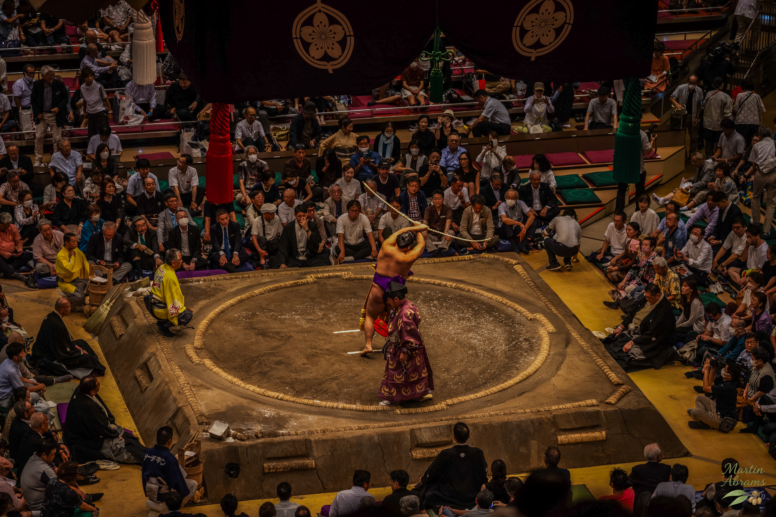 Sumo - champion swings staff